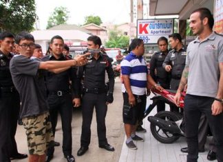 Teeradate Kakrong reenacts the shooting for police and the press.