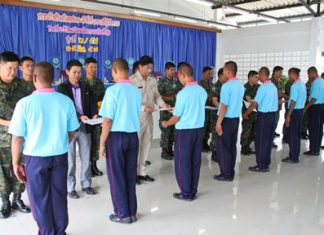 Graduates line up to receive their certificates for finishing their requirements for “drug rehab school”.