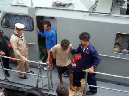 The Royal Thai Navy brings ashore fishermen who floated in the sea for 18 hours after their boat sank.