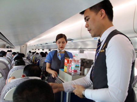 Kan Air staff serve the airline’s first passengers on its new route from U-Tapao.