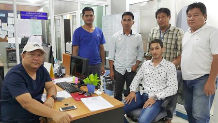 Anas Saleem Ali Alsharab (seated, right) has been arrested for trying to extend a fake visa in his fake passport.