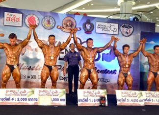 Thailand’s Sudjai Janthalek (centre) celebrates winning the male over 75kg bodybuilding title at the RGP EX-Fever Muscle & Physique Contest held at the Royal Garden Plaza shopping mall in Pattaya, Saturday, May 30.