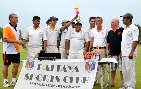 The Pakistan Sports Club team hoist the Super 8’s trophy as they are joined by Pattaya Cricket Club Captain Simon Philbrook (far left), Tournament Director Joe Grunwell (2nd right) and Thai Polo Club MD, Kh. Surapol (3rd right).