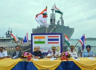 Visiting Indian naval officers and the Indian Ambassador to Thailand hold a press conference off the bow of the INS Satpura.