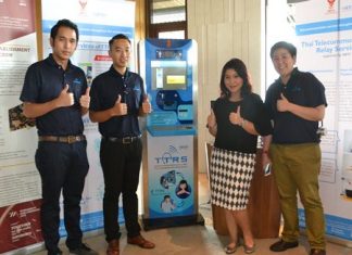 Representatives from TTRS show off the new Internet-enabled device that allows deaf people to communicate by telephone using sign language.