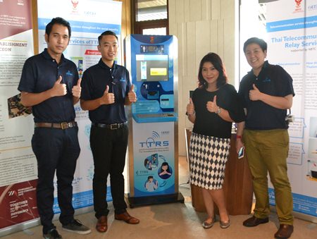 Representatives from TTRS show off the new Internet-enabled device that allows deaf people to communicate by telephone using sign language.