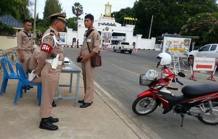 A sailor is stopped at an inspection station on his way in to the base, as part of the Navy’s crackdown on on-duty drinking.
