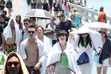 Bali Hai Pier is bustling with tourists taking ferries and speedboats to Koh Larn to escape the hustle and bustle of Pattaya.