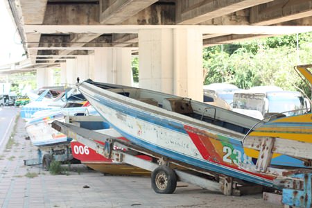 Broken down speedboats parked under the overpass create an eyesore that is being ignored by the city.