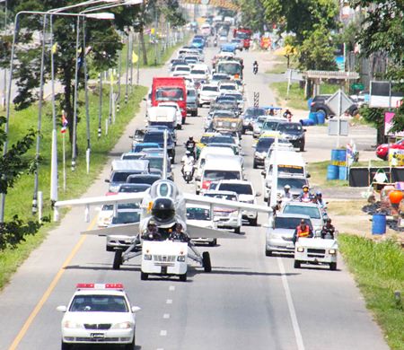 Unused for almost 8 years, moving this A-7E Corsair II bomber along the highway to the Naval Education Center drew many shutterbugs in Sattahip. 