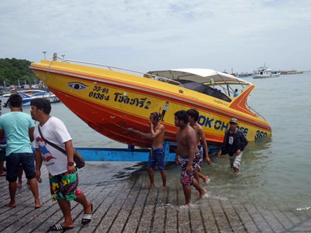 The Chok Charlee 2 is brought ashore after nearly sinking about a nautical mile off Bali Hai Pier.