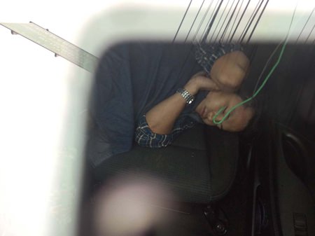 Police couldn’t wake Pornchai Wongtam so they left him inside his car whilst they towed it to the police station.