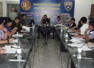 Pol. Col. Jedsada Yaisun, deputy commander of Immigration Division 3, talks to officers about increasing the efficiency of their services.