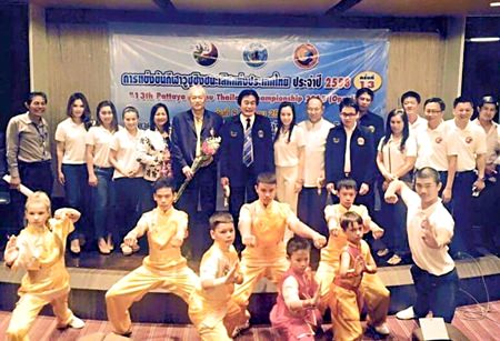 Ronakit Eakasing, Pattaya Deputy Mayor (standing centre rear), poses with competition organizers and Wushu students at a press conference held July 21 to announce the upcoming Pattaya Wushu Championships.