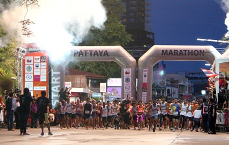 Fireworks and air-horns signal the start of the 2015 Pattaya Marathon.