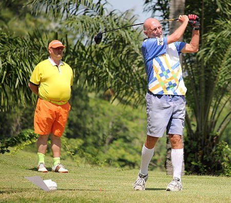 Len Jones (right) tees off at Crystal Bay, watched by Ian Wilson.