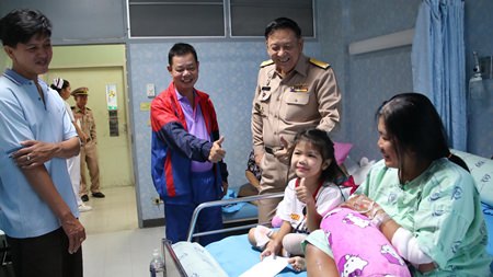 Young Miss Patidtha, after having one of her legs amputated as a result of a horrific crash, puts on a brave face, giving thumbs up to the visiting entourage.