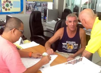 Tom Henning Bruvold (center) said he had not intended to stay in Thailand longer than his visa allowed, but he had run out of money.