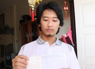 Yutapong Sirikanyalak shows the exorbitant water bills he received, adding up to 31,187 baht after only 2 months.