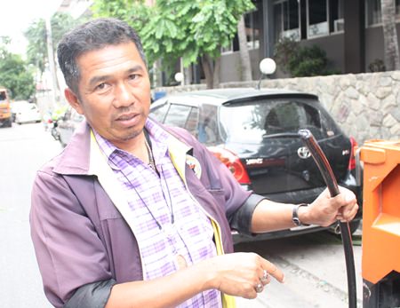 Prasong Phuet-udompol, assistant chief engineer of the Banglamung PEA, shows the new wires that are being used to replace the original, worn out wires.