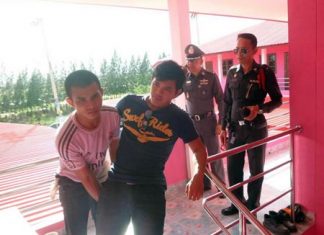 Confessed murderer Tawatchai Moonwaree tries to reenact the crime for police.