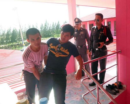 Confessed murderer Tawatchai Moonwaree tries to reenact the crime for police.