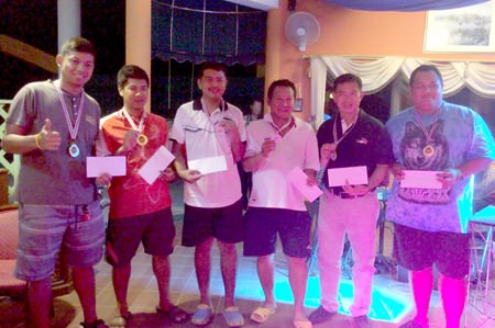 Members of Team Bus and Team Ing pose for a photo at the completion of the triples final at the Coco Club in Pattaya, Sunday, August 23.