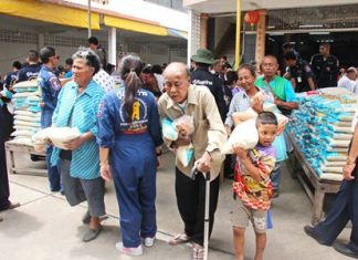 Folks less fortunate were grateful to receive some help from local benevolent people taking part in the merit making ceremony.