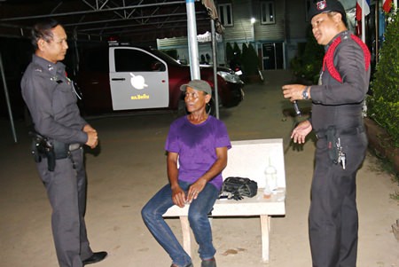 Allegedly in a drunken stupor, Udom Chanta (seated) told police he had murdered someone and wanted to turn himself in.