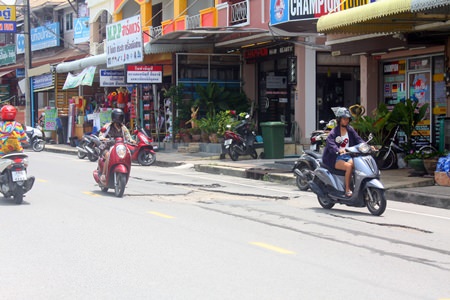 Residents need to be careful on Khao Talo Road, and avoid areas that look more like the surface of the moon than a street.