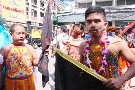 Devotees of the Kuan-Oo Shrine in Sattahip express their dedication to Chinese Taoist gods through blood in a display intended to demonstrate their gods’ supernatural effect. During the annual Vegetarian Festival, these acts are performed as a way for Chinese-Thais to purify themselves through pain and complete abstinence from meat, sex and other vices. 