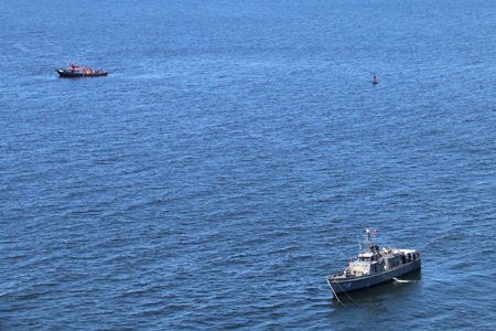 Helicopter crews and divers took a final shot at finding four crewmen of a containership that sank near the mouth of the Chao Phraya River, but failed to find their bodies.