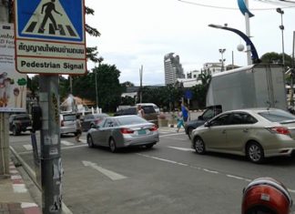 The crosswalk button and crosswalk are too far apart.