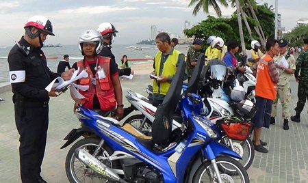 Chonburi transportation officials check for illegal motorbike taxi operators.