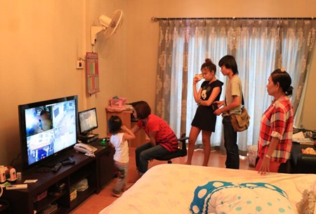 Security cameras captured video of an Asian man scaling a fence, jimmying a side door and breaking into a bedroom safe.