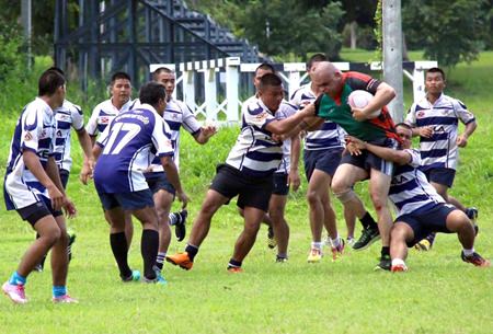 It takes a whole squadron of Navy players to pull down a rampaging Panther.