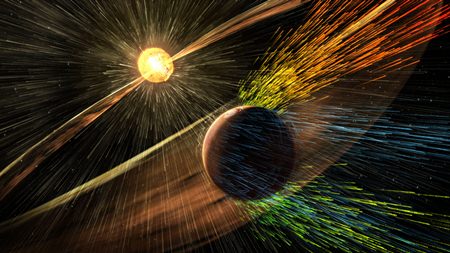 This image made available by NASA shows an artist’s rendering of a solar storm hitting the planet Mars and stripping ions from the planet’s upper atmosphere. (Goddard Space Flight Center/NASA via AP)