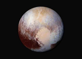 The New Horizons spacecraft was programmed to fire its thrusters Thursday, Oct. 22, 2015, putting it on track to fly past a recently discovered, less than 30-mile-wide object out on the solar system frontier. The close encounter with 2014 MU69 would occur in 2019. It orbits nearly 1 billion miles beyond Pluto (shown here). (NASA/JHUAPL/SwRI via AP)