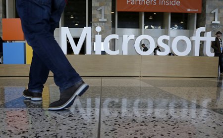 Starting next year, Microsoft will cut the free space it offers through its OneDrive service to 5 gigabytes, down from 15 gigabytes now. Microsoft says the new allotment is enough for about 6,600 Office documents or 1,600 photos. (AP Photo/Jeff Chiu, File)