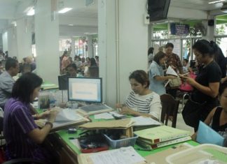 The Banglamung Land Office was packed on the first day that land title transfer fees were cut to nearly zero percent.