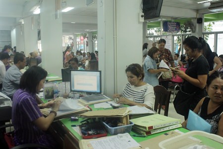 The Banglamung Land Office was packed on the first day that land title transfer fees were cut to nearly zero percent.
