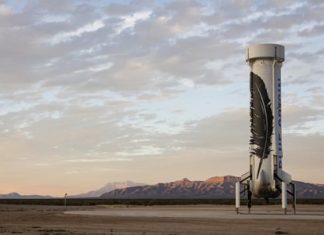 In this photo provided by Blue Origin taken on Monday, Nov. 23, 2015, an unmanned Blue Origin booster rocket sits after landing in Van Horn, West Texas. (Blue Origin via AP)