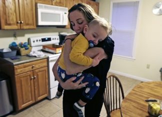 Cancer survivor Christine Ells embraces her twenty-month-old son Jameson after arriving home from work in Whitman, Mass. Ells, 36, a teacher in the Boston suburb of Quincy, developed a heart rhythm problem from several drugs she was given to treat the breast cancer she was diagnosed with at age 27. Certain cancer drugs, such as Herceptin and doxorubicin, sold as Adriamycin and other brands, can hurt the heart’s ability to pump, and lead to heart failure. (AP Photo/Charles Krupa)