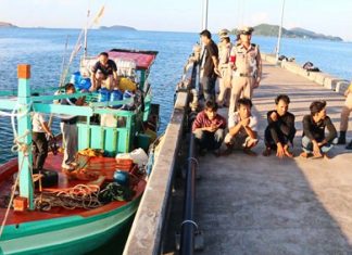 Navy captures Vietnamese fishing boat Captain and crew sit on a Thai Navy dock as officials search their tiny vessel.