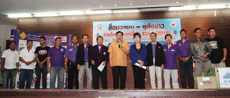 Chonburi Deputy Gov. Phawat Lertmukhda (center) welcomes guests to the annual Chonburi Press Association year-end party.