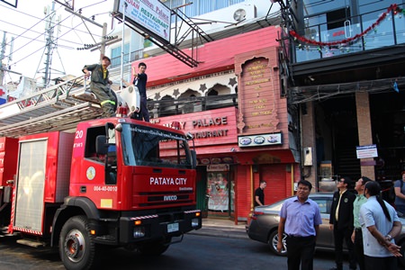 City officials, led by City Councilman Anupong Bhudanawarut, bring a fire engine along to check signage heights on Walking Street.