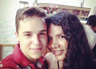 This Nov. 11, 2015 photo courtesy of Fernando Machado shows him, left, taking a selfie with his partner Diane Rodriguez in Guayaquil, Ecuador. (Fernando Machado via AP)