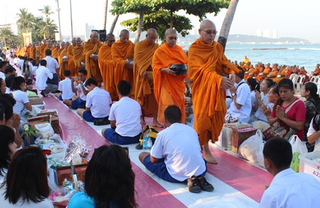 During morning alms, 1,199 monks gather money and necessities destined for monks in Thailand’s troubled south.