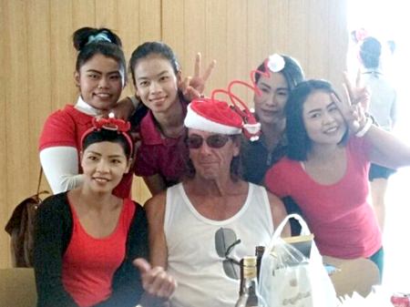 Pottsy (centre) poses with some of the PCC caddies during the Christmas golfing fun day.