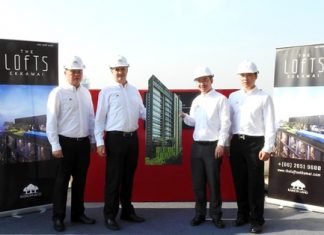 (From left to right) Raimon Land executives Clifford Chan, Manager – Project Commercial; Gerard Healy, Vice President – Development; Sataporn Amornvorapak, Director & Chief Financial Officer; and Chaipat Taechapornwiwat, Deputy Vice President – Construction, pose for a photo during the topping-off ceremony for The Lofts Ekkamai in Bangkok on February 5.
